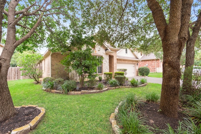 1109 Jacobs Lake Blvd, Conroe, TX 77384 - view of property hidden behind natural elements with driveway, brick siding, and an attached garage