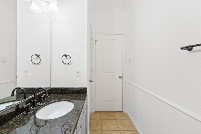 1109 Jacobs Lake Blvd, Conroe, TX 77384 - bathroom featuring crown molding, tile patterned floors, vanity, and a wainscoted wall