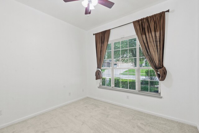 1109 Jacobs Lake Blvd, Conroe, TX 77384 - empty room with carpet flooring and ceiling fan