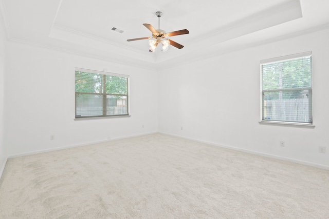 1109 Jacobs Lake Blvd, Conroe, TX 77384 - carpeted spare room with a tray ceiling, ornamental molding, healthy amount of natural light, and a ceiling fan