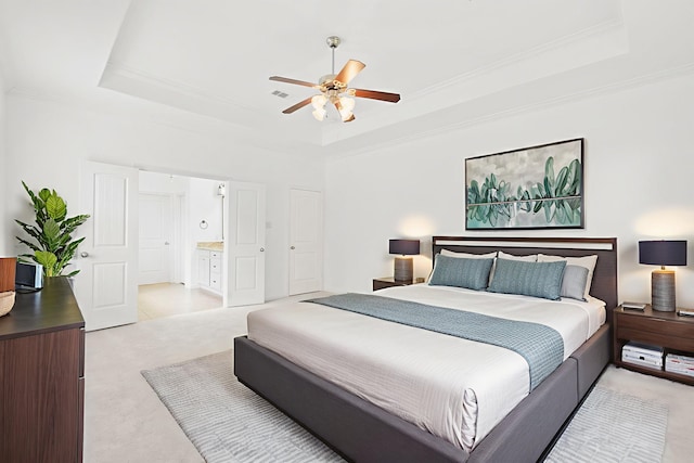 1109 Jacobs Lake Blvd, Conroe, TX 77384 - bedroom with a raised ceiling, light colored carpet, ornamental molding, and connected bathroom