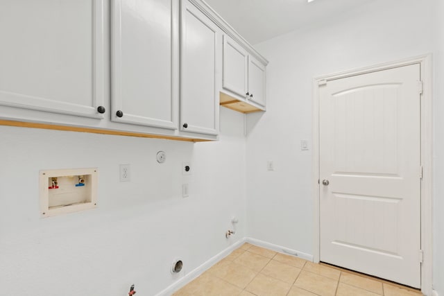 1109 Jacobs Lake Blvd, Conroe, TX 77384 - laundry area with gas dryer hookup, hookup for a washing machine, electric dryer hookup, light tile patterned flooring, and cabinet space