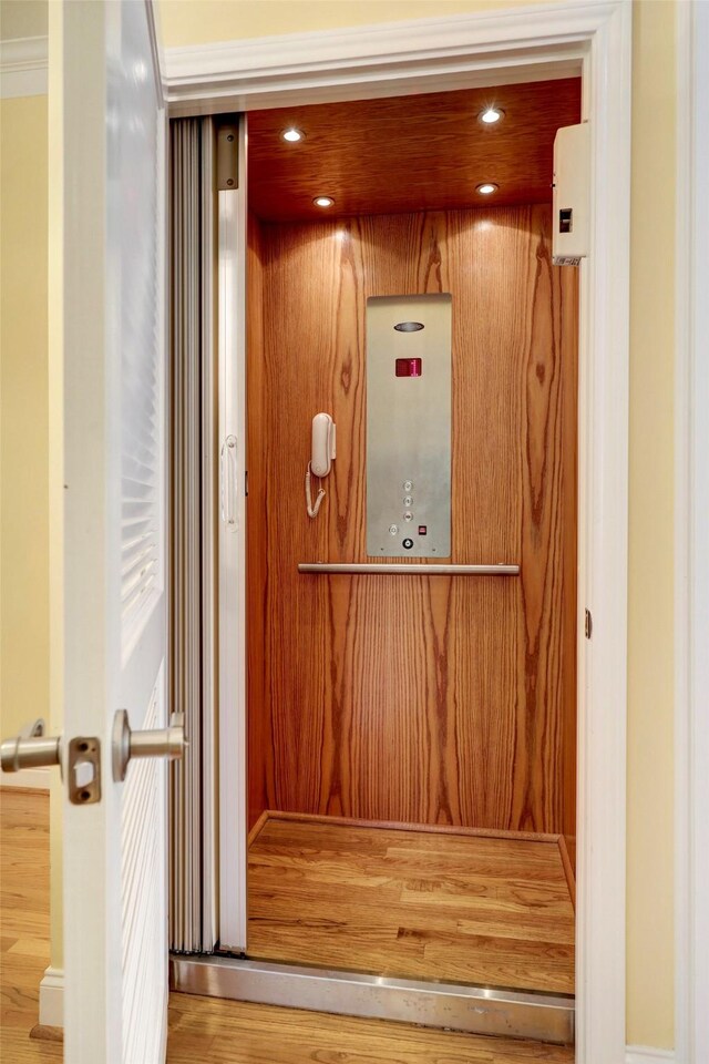 5346 Mcculloch Cir, Houston, TX 77056 - elevator with wood finished floors and recessed lighting
