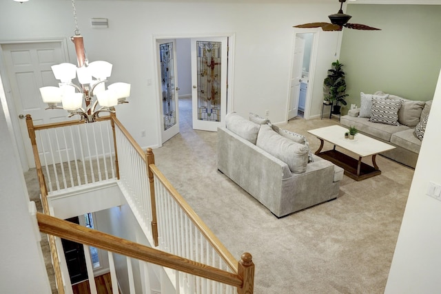 5346 Mcculloch Cir, Houston, TX 77056 - carpeted living area featuring a chandelier, ceiling fan, french doors, and stairway