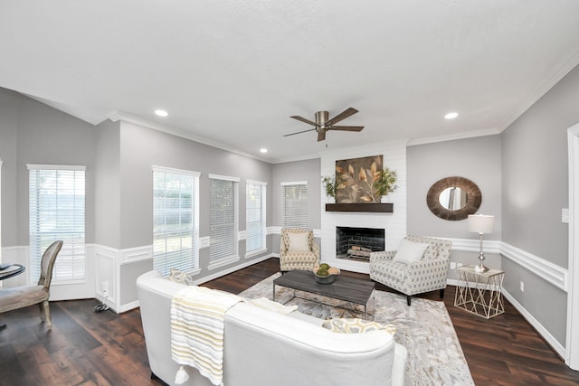 8618 Aldeburgh Ct, Spring, TX 77379 - living room with ceiling fan, wood finished floors, a large fireplace, plenty of natural light, and crown molding