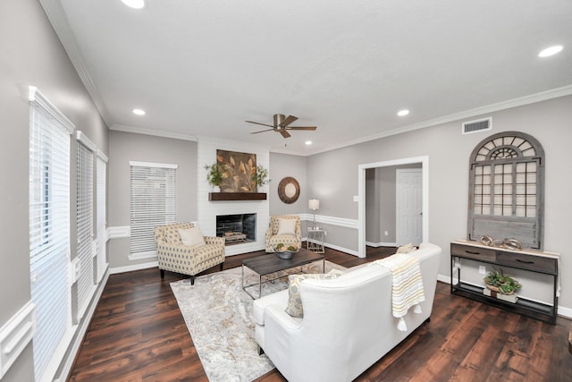 8618 Aldeburgh Ct, Spring, TX 77379 - living room featuring ceiling fan, recessed lighting, a fireplace, ornamental molding, and wood finished floors