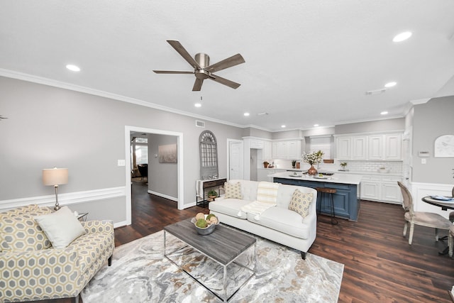 8618 Aldeburgh Ct, Spring, TX 77379 - living area featuring a ceiling fan, recessed lighting, crown molding, and dark wood-type flooring