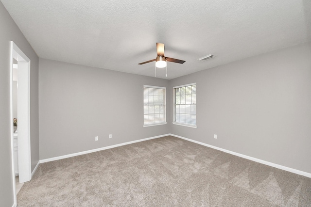 8618 Aldeburgh Ct, Spring, TX 77379 - spare room featuring a ceiling fan, carpet flooring, and a textured ceiling
