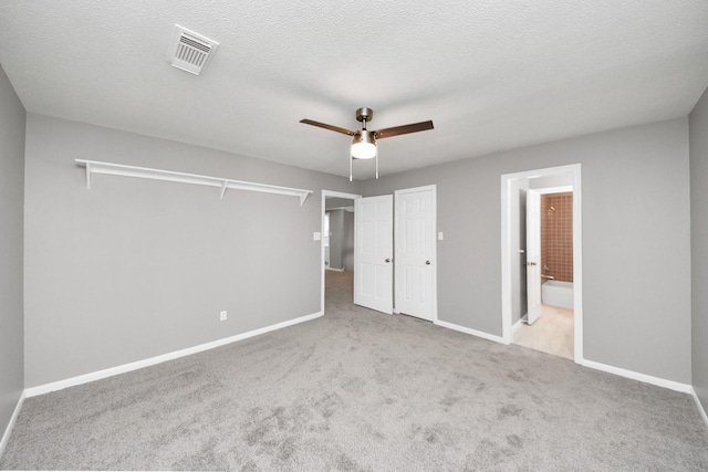 8618 Aldeburgh Ct, Spring, TX 77379 - unfurnished bedroom featuring carpet flooring, connected bathroom, and a ceiling fan