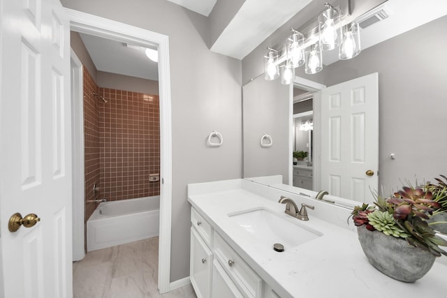 8618 Aldeburgh Ct, Spring, TX 77379 - full bath featuring vanity, marble finish flooring, and tub / shower combination