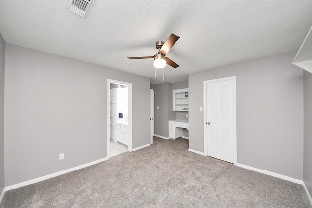 8618 Aldeburgh Ct, Spring, TX 77379 - unfurnished bedroom with carpet flooring, connected bathroom, and a ceiling fan
