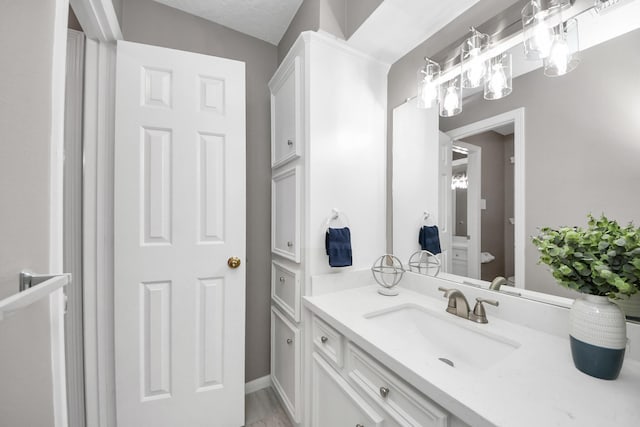 8618 Aldeburgh Ct, Spring, TX 77379 - bathroom featuring vanity and a chandelier