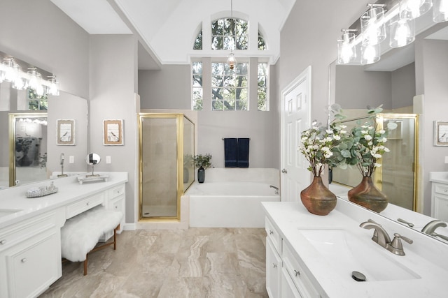 8618 Aldeburgh Ct, Spring, TX 77379 - bathroom featuring two vanities, a shower stall, a garden tub, and high vaulted ceiling