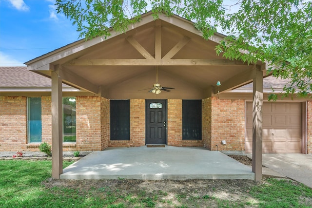 29318 Waltham St, Spring, TX 77386 - view of exterior entry featuring brick siding, a ceiling fan, an attached garage, and roof with shingles