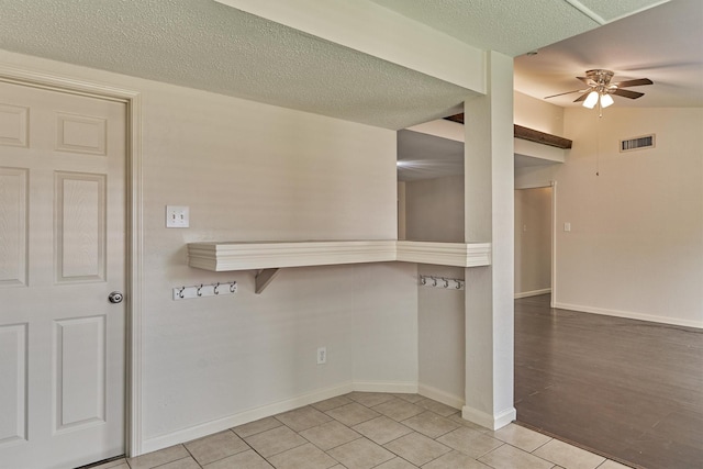 29318 Waltham St, Spring, TX 77386 - empty room with a ceiling fan, light tile patterned flooring, and a textured ceiling