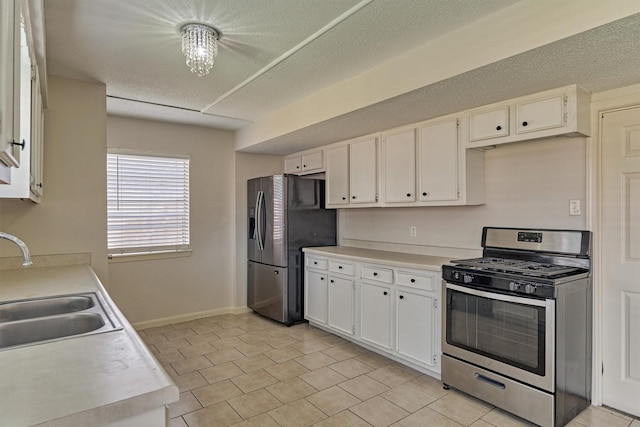 29318 Waltham St, Spring, TX 77386 - kitchen featuring appliances with stainless steel finishes, white cabinets, light countertops, and light tile patterned floors