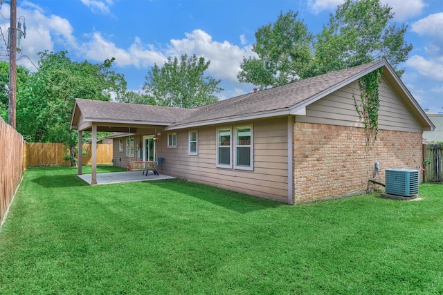 29318 Waltham St, Spring, TX 77386 - rear view of property featuring a patio area, brick siding, a fenced backyard, and roof with shingles