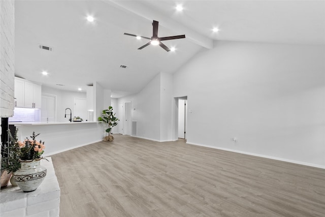 13403 Splintered Oak Dr, Houston, TX 77065 - unfurnished living room with light wood-type flooring, beamed ceiling, high vaulted ceiling, a ceiling fan, and recessed lighting