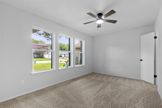 13403 Splintered Oak Dr, Houston, TX 77065 - empty room with healthy amount of natural light, ceiling fan, and light colored carpet