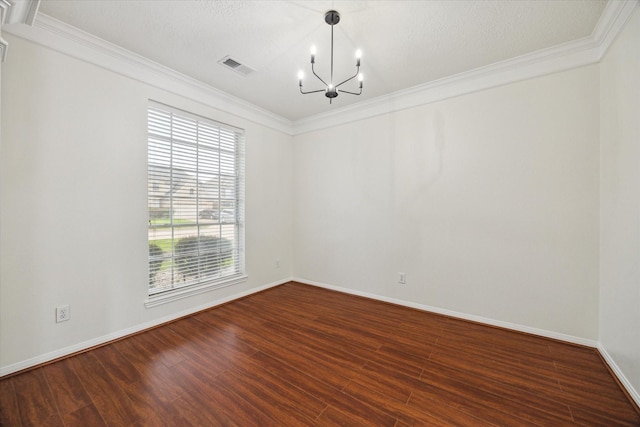 18518 Autumn Park Dr, Houston, TX 77084 - spare room with ornamental molding, a chandelier, and dark wood-type flooring