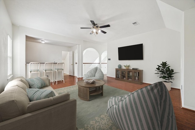 18518 Autumn Park Dr, Houston, TX 77084 - living area featuring dark wood-style floors, ceiling fan, and arched walkways