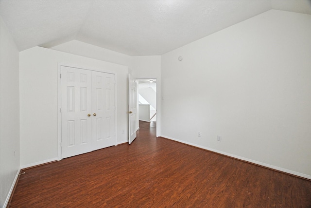 18518 Autumn Park Dr, Houston, TX 77084 - unfurnished bedroom featuring vaulted ceiling, wood finished floors, and a closet