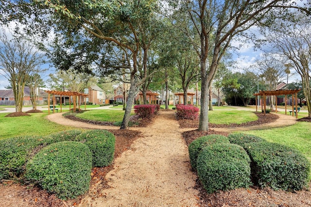 18518 Autumn Park Dr, Houston, TX 77084 - view of green lawn featuring a pergola and a residential view