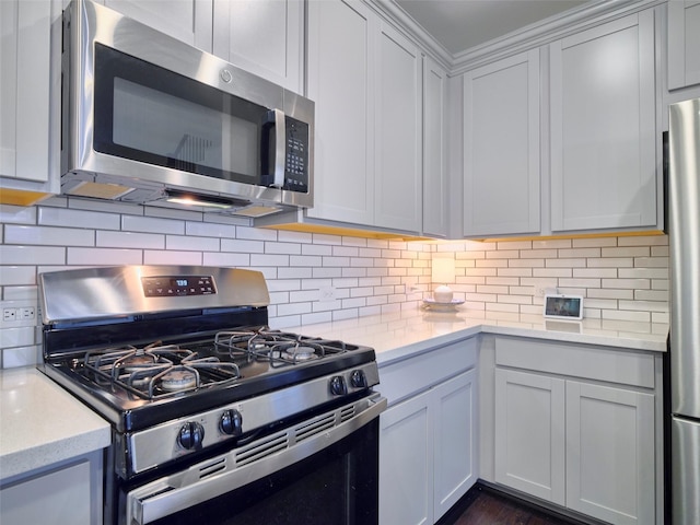 400 Beken Cove Ln, La Porte, TX 77571 - kitchen featuring stainless steel appliances, tasteful backsplash, and light stone counters