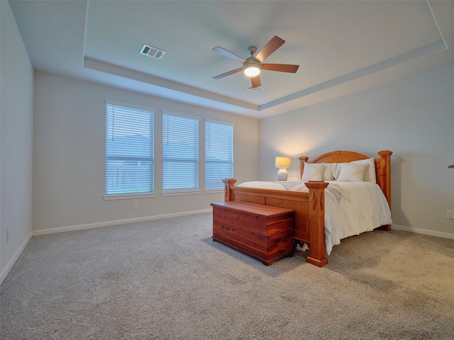 400 Beken Cove Ln, La Porte, TX 77571 - bedroom with a tray ceiling, carpet, and ceiling fan