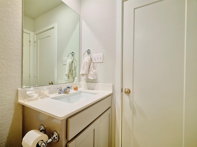 400 Beken Cove Ln, La Porte, TX 77571 - bathroom featuring a textured wall and vanity