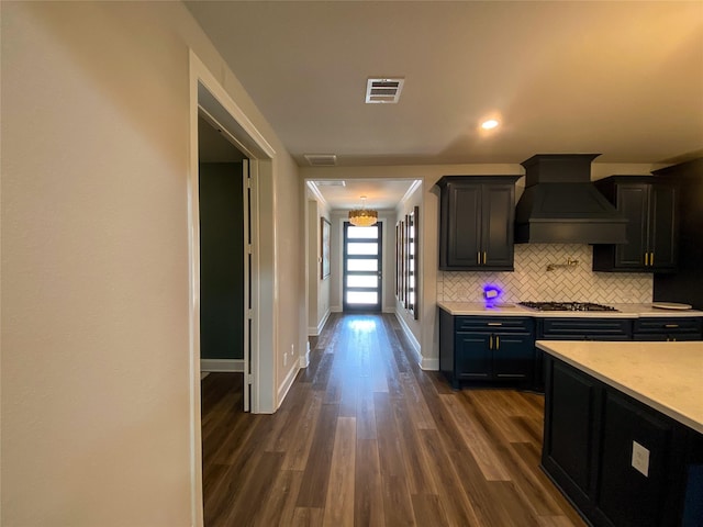 10011 Serenity Grove Dr, Missouri City, TX 77459 - kitchen featuring custom range hood, light countertops, decorative backsplash, stainless steel gas stovetop, and recessed lighting