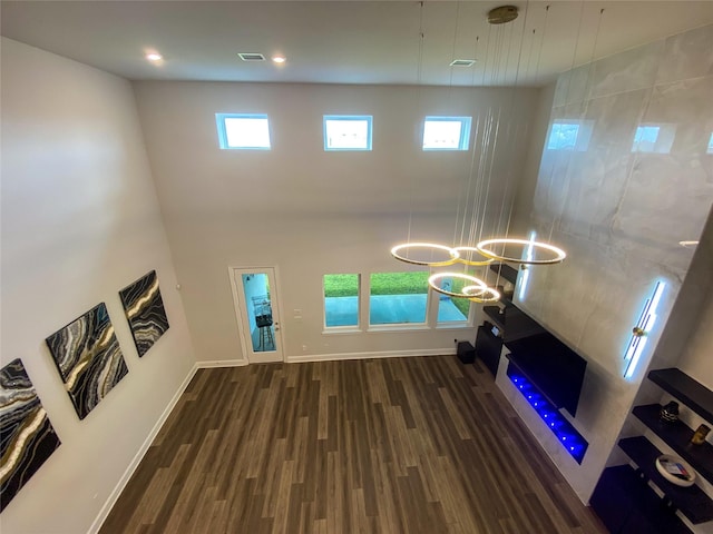 10011 Serenity Grove Dr, Missouri City, TX 77459 - unfurnished living room featuring wood finished floors and a high ceiling