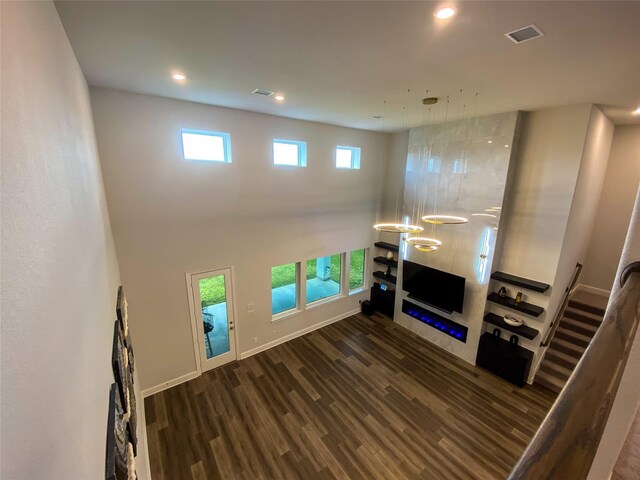 10011 Serenity Grove Dr, Missouri City, TX 77459 - unfurnished living room with dark wood-type flooring and recessed lighting