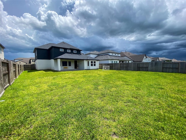 10011 Serenity Grove Dr, Missouri City, TX 77459 - back of property featuring a fenced backyard and roof with shingles