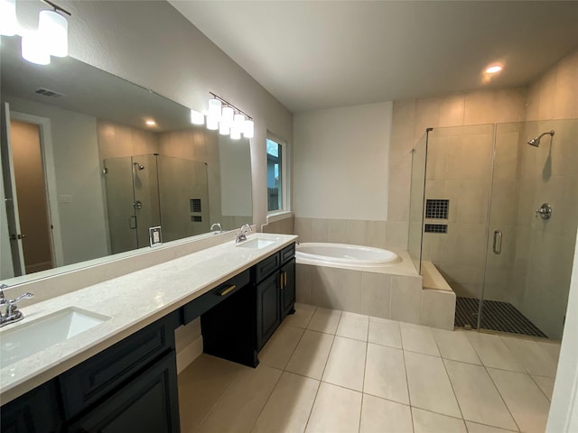 10011 Serenity Grove Dr, Missouri City, TX 77459 - bathroom with a stall shower, a bath, tile patterned floors, double vanity, and recessed lighting