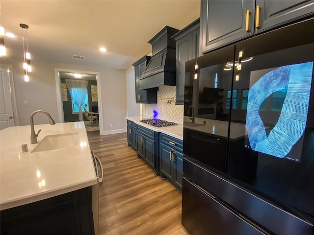 10011 Serenity Grove Dr, Missouri City, TX 77459 - kitchen featuring refrigerator, stainless steel gas stovetop, light wood-type flooring, backsplash, and recessed lighting