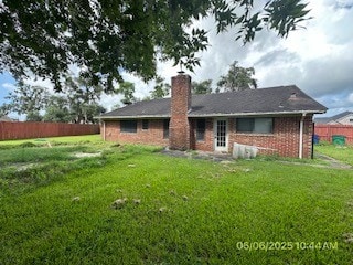 288 Twin Lakes Blvd W, West Columbia, TX 77486 - back of property with a chimney and brick siding