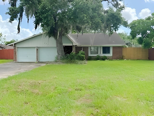 288 Twin Lakes Blvd W, West Columbia, TX 77486 - view of front facade with a garage and concrete driveway