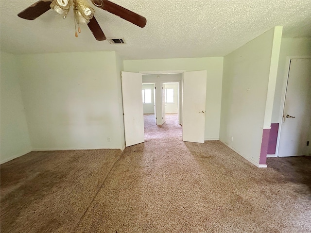 288 Twin Lakes Blvd W, West Columbia, TX 77486 - empty room featuring a ceiling fan, carpet floors, and a textured ceiling
