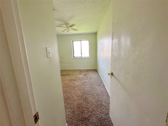 288 Twin Lakes Blvd W, West Columbia, TX 77486 - spare room featuring ceiling fan, carpet flooring, and a textured ceiling
