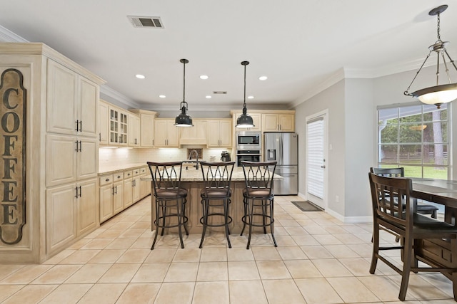 28632 Beth Marie, Magnolia, TX 77355 - kitchen featuring stainless steel appliances, backsplash, a breakfast bar, light tile patterned floors, and ornamental molding