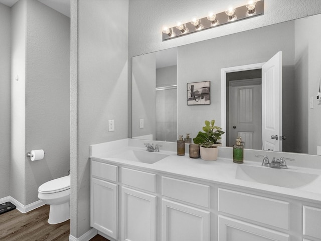 22010 Great Royal Ln, Houston, TX 77073 - full bath with wood finished floors, double vanity, and an enclosed shower