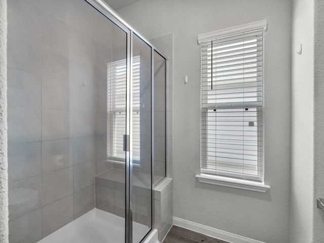 22010 Great Royal Ln, Houston, TX 77073 - full bath featuring a stall shower, healthy amount of natural light, and wood finished floors