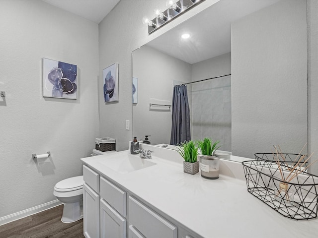 22010 Great Royal Ln, Houston, TX 77073 - full bathroom featuring wood finished floors, vanity, a shower with shower curtain, and a textured wall