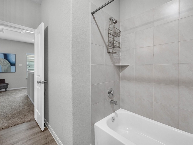 22010 Great Royal Ln, Houston, TX 77073 - full bathroom with washtub / shower combination and wood finished floors