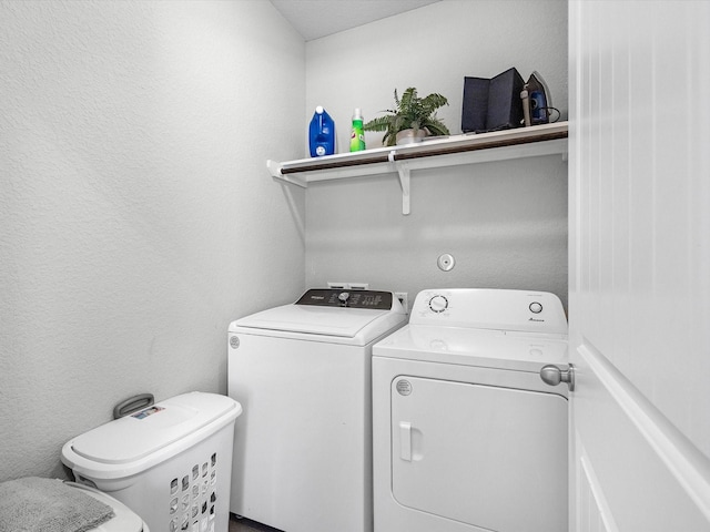 22010 Great Royal Ln, Houston, TX 77073 - laundry room featuring washing machine and dryer and a textured wall