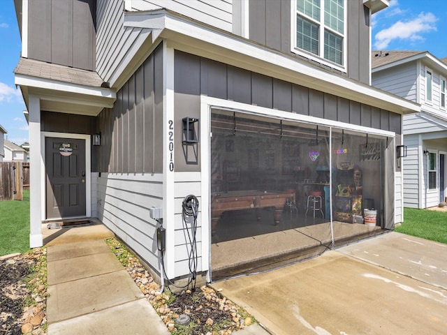 22010 Great Royal Ln, Houston, TX 77073 - view of exterior entry with board and batten siding and an attached garage