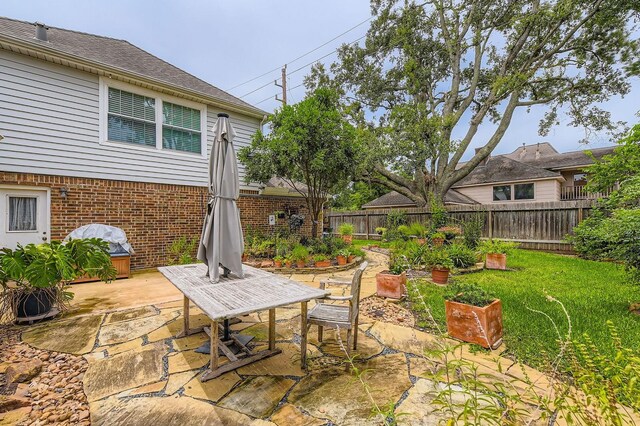 20746 Prince Creek Dr, Katy, TX 77450 - fenced backyard featuring a patio and grilling area