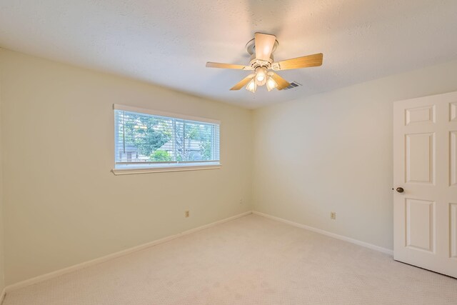 20746 Prince Creek Dr, Katy, TX 77450 - empty room with light carpet and ceiling fan
