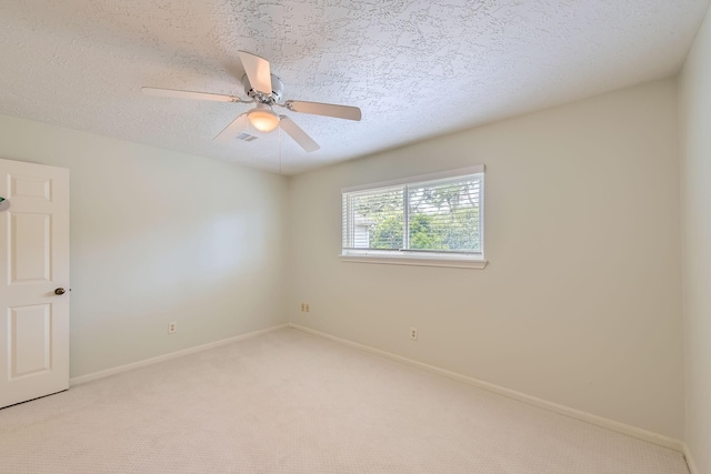 20746 Prince Creek Dr, Katy, TX 77450 - unfurnished room featuring light colored carpet, a ceiling fan, and a textured ceiling